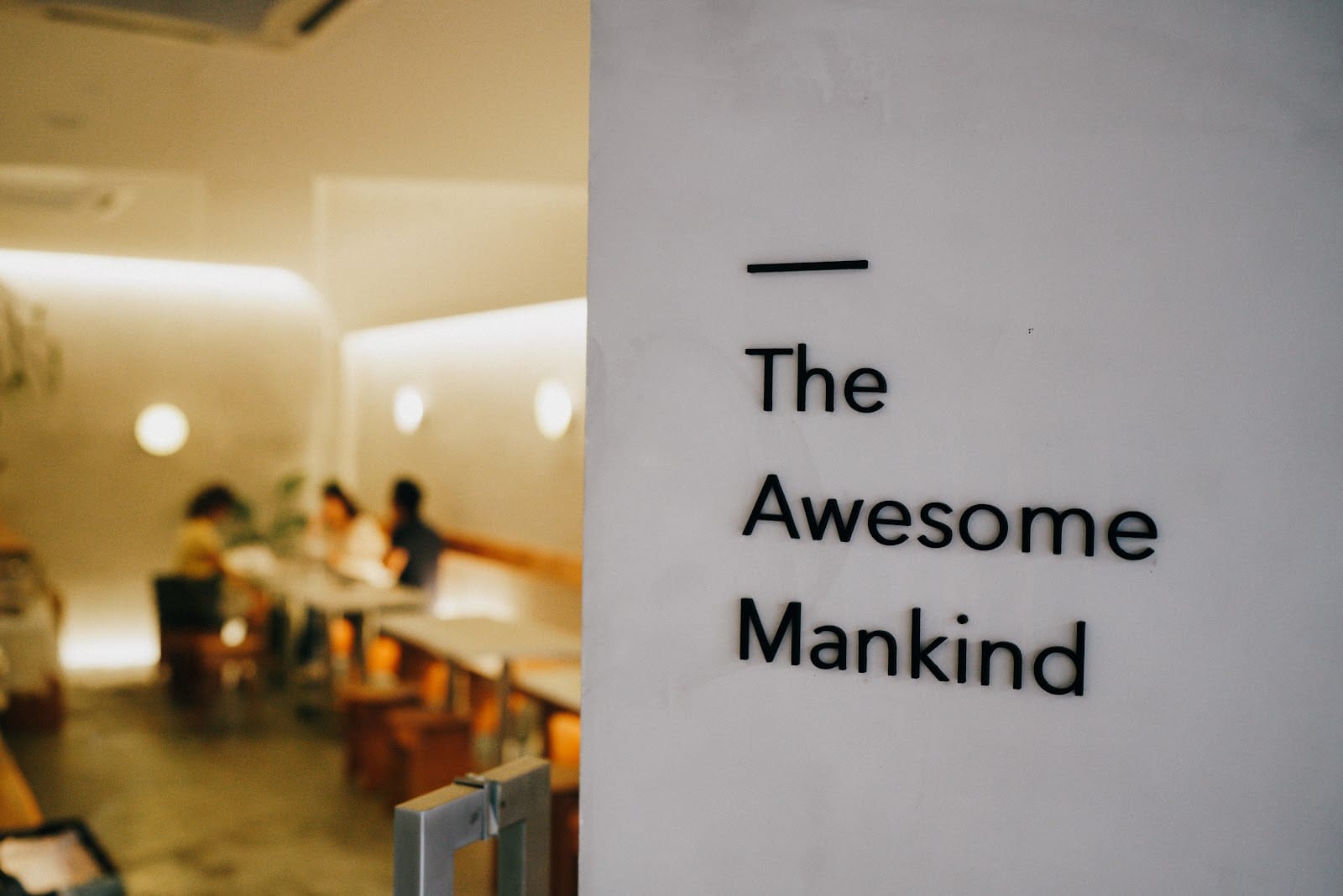 The Awesome Mankind lettered on a wall at Principle Café Jalan Trus