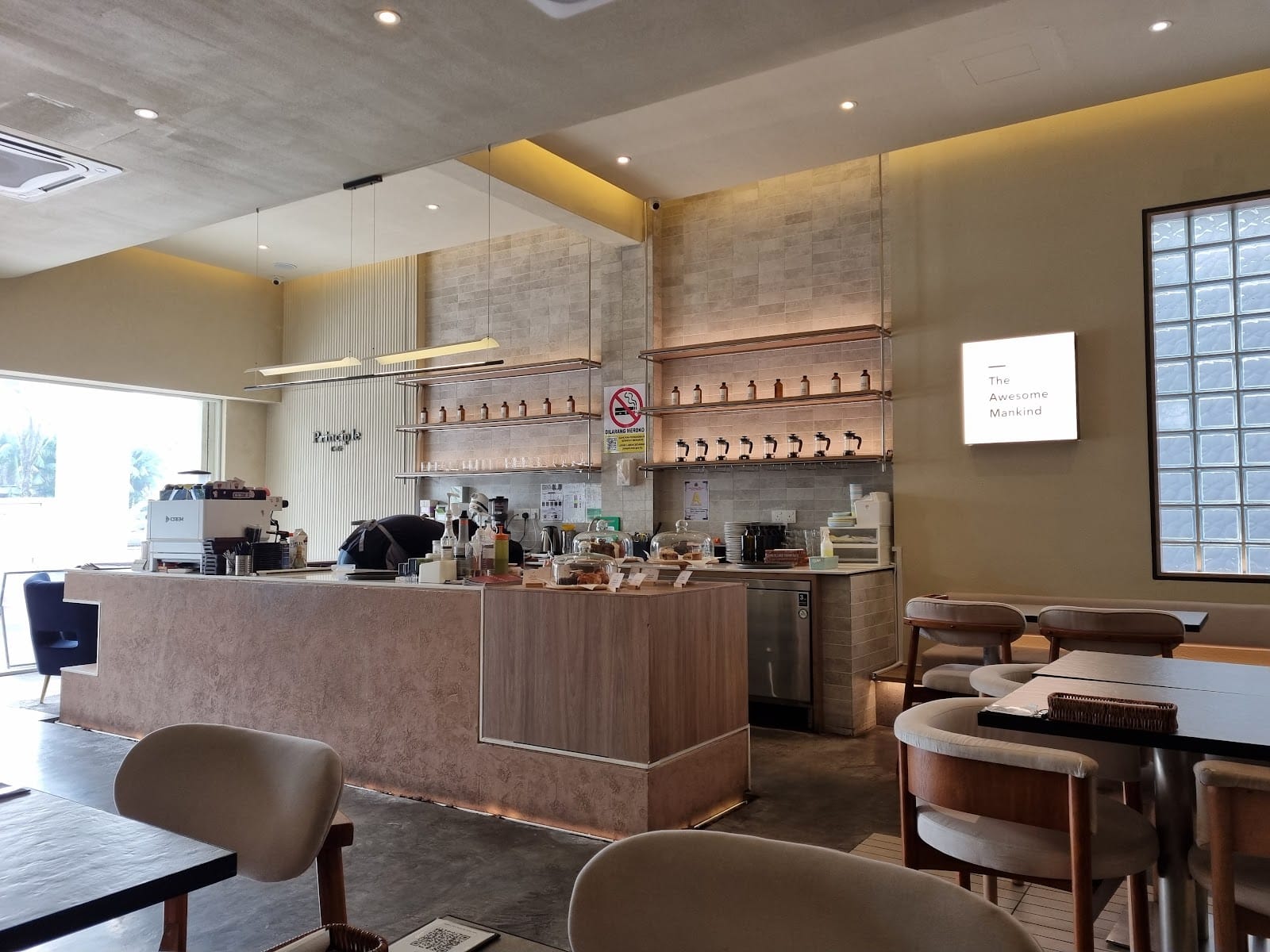Principle Café Mount Austin — the coffee bar, shelves and The Awesome Mankind light box