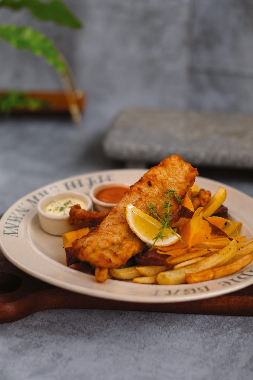 Crispy Battered Fish & Chips with two sauces and lemon