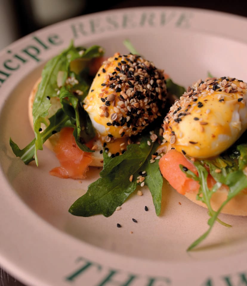 Poached eggs with smoked salmon on a Principle Reserve plate